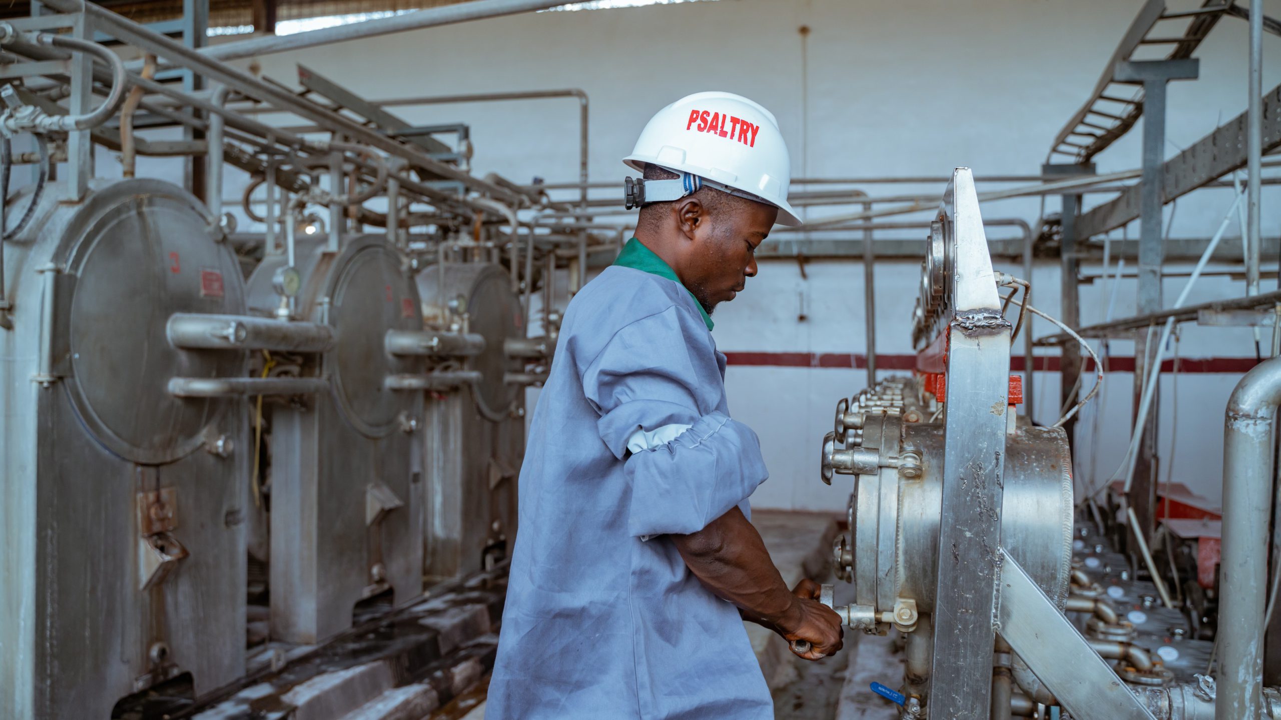 Sustainability Practices in Cassava Refining black man at work in cassava refinery